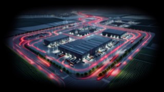 As soluções da Linde ajudam a garantir o fluxo de produção na indústria automóvel. O pavilhão de armazenamento visto de cima à noite
